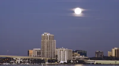 Full moon rising over downtown Clearwater and the Memorial Causeway bridge across Clearwater Harbor